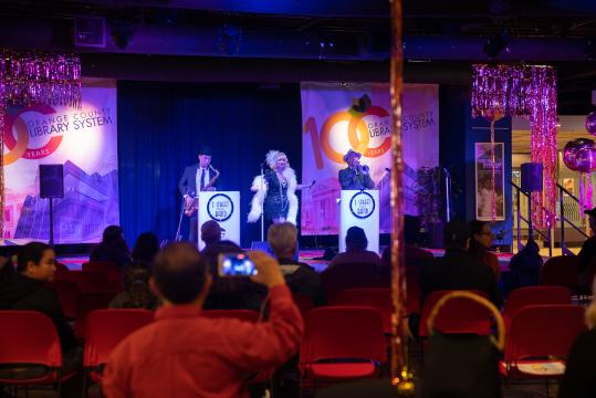 100 Year Kickoff - Photo of the Z Street Speakeasy Band performing on the stage in Library Central