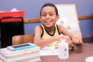 Boy with school supplies