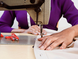 Person using a sewing machine.