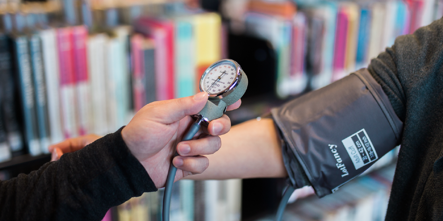 blood pressure monitoring cuff on arm