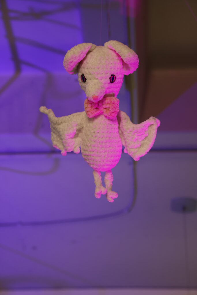 crochet white bat with a pink bow tie