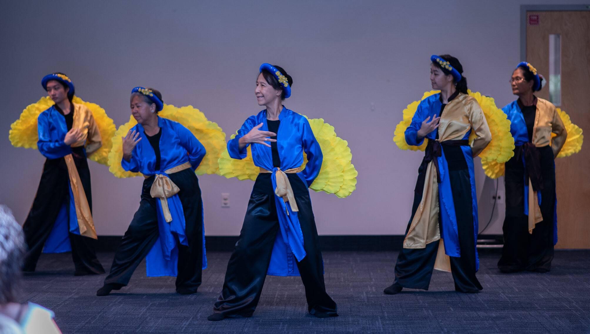 Thuyen May dancers performing on stage at Chickasaw Branch