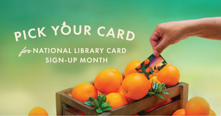 Title: Pick Your Card for National Library Card Sign-up Month.

Photo: Hand pulling new library card out of an orange crate full of oranges.