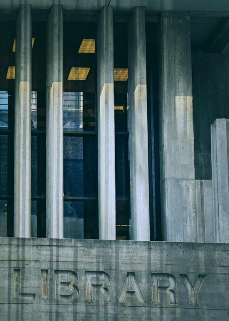 Abstracted photo of the entrance to the Orlando Public Library. The word "Library" can be seen, along with vertical lines.