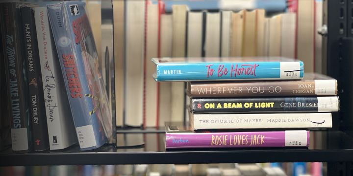 Stack of books on shelf create poem: To be honest, wherever you go - on a beam of light, the opposite of maybe: Rosie loves Jack
