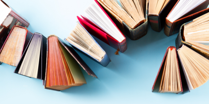 Hardback books arranged in a wave pattern