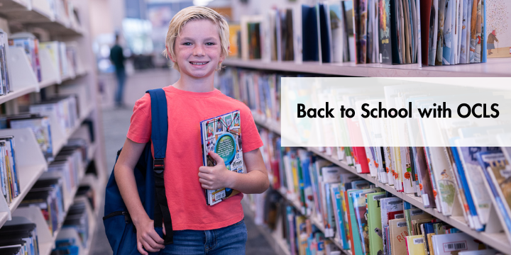 Student prepares for back to school with backpack and book in library stacks