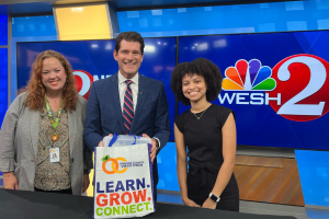 library staff and WESH Anchor Jason Guy in WESH studio 