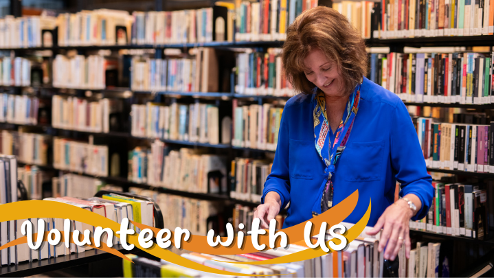 A smiling woman places books on a cart. The text reads "Volunteer with Us".