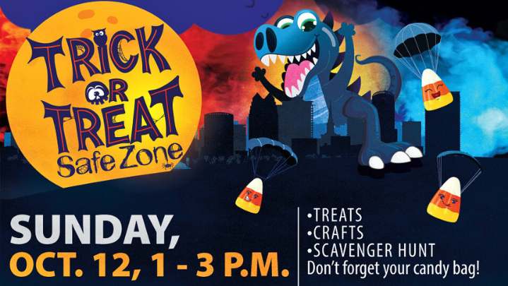A colorful scene of a giant smiling dinosaur walking through a city, with candy corn felling around him. The text reads "Trick or Treat Safe Zone, Sunday, October 12, 1 to 3 p.m."