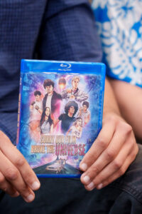 Hands holding a blu-ray copy of Sorry Our Film Broke the Universe.