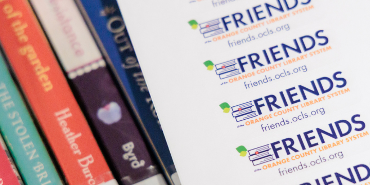 Friends of the Library stickers on row of books
