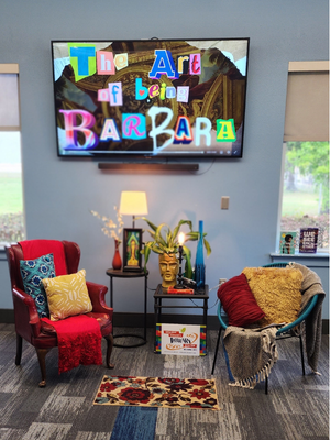 living room style set up for library event designed by Ricardo Burney