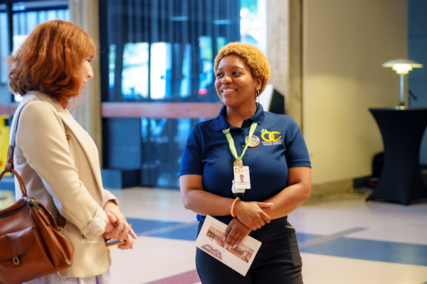 Jazmyne Arnett talks with library supporter in Orlando Public Library lobby